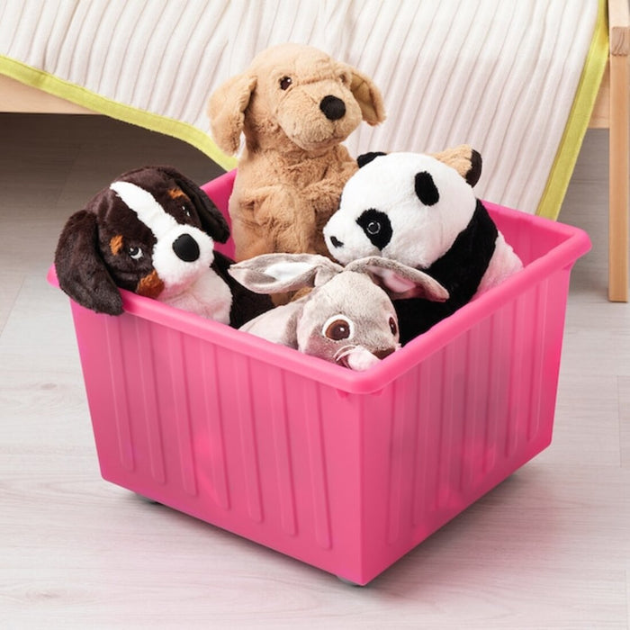 A sleek and modern pink IKEA storage unit with multiple compartments, perfect for living room organization."