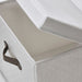 An IKEA storage box in dark grey color with a fitted lid, designed to keep contents safe and secure.
