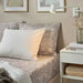  A grey cotton pillowcase from IKEA lying on a bed adding a touch of elegance to the bedding 70501490