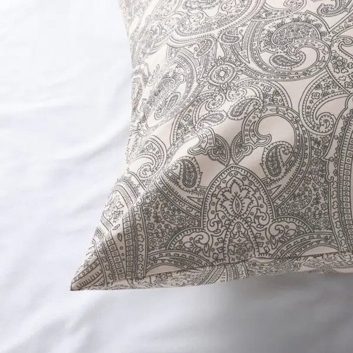 The edge of a grey pillowcase from IKEA, highlighting its bright and cheerful color  70501490
