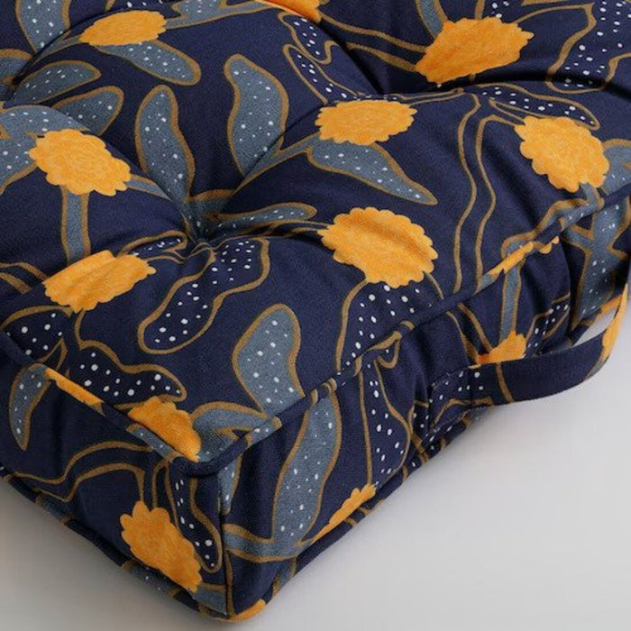 A set of matching blue and yellow floor cushions from IKEA, perfect for a modern living room. 10541861