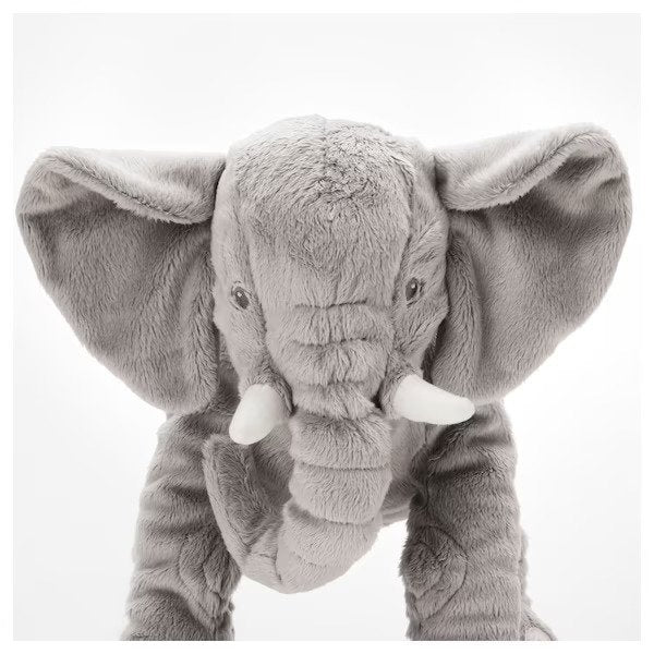 An adorable grey plush IKEA Soft Toy with an elephant shape, featuring floppy ears and a long trunk.