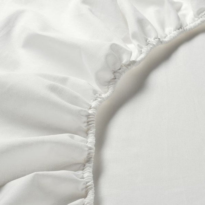 A close-up of an IKEA fitted sheet's elastic edges shows its stretchiness and durability -90347681