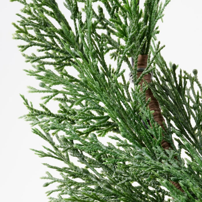 Digital Shoppy An indoor/outdoor artificial wreath featuring lifelike cypress leaves, 38 cm in size, from IKEA.  10496552