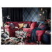 Multiple IKEA cushion covers in different colors and designs on a sofa-30416743