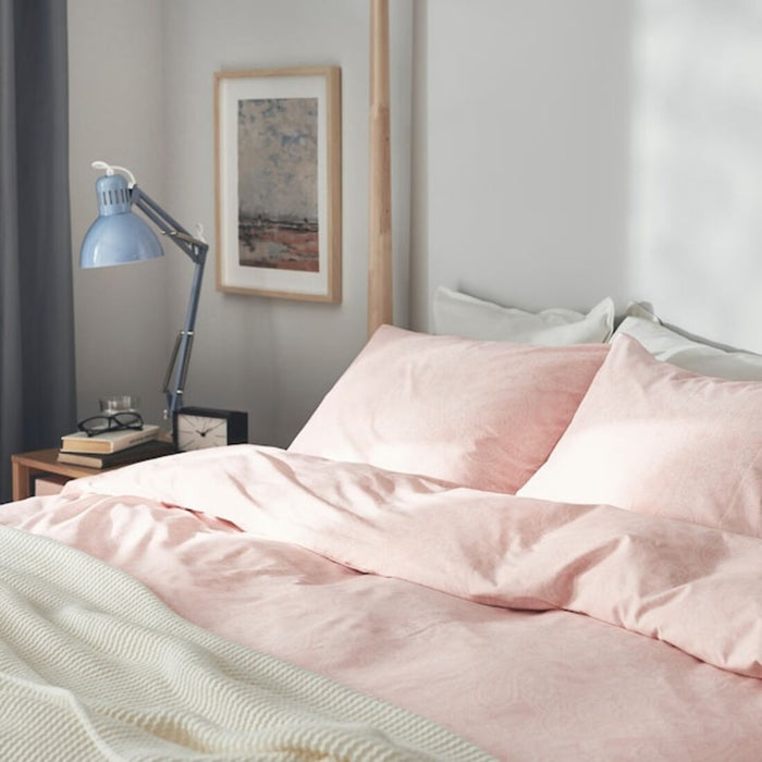 A close-up shot of IKEA's duvet cover in a soft light pink color with matching pillowcases   50500689