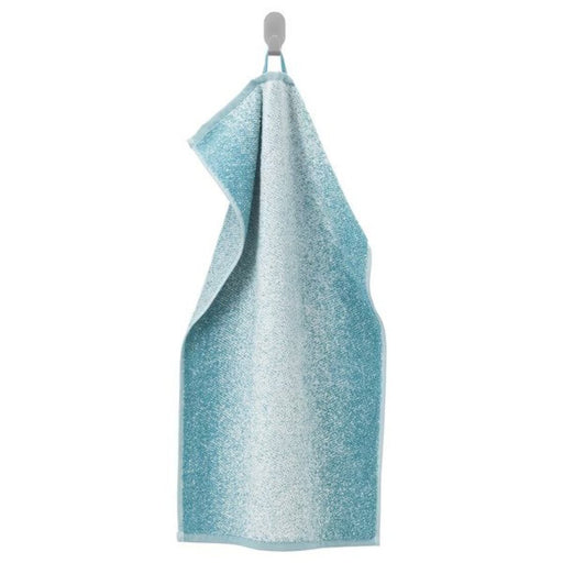 A white/turquoise hand towel with a soft, smooth texture 20494388