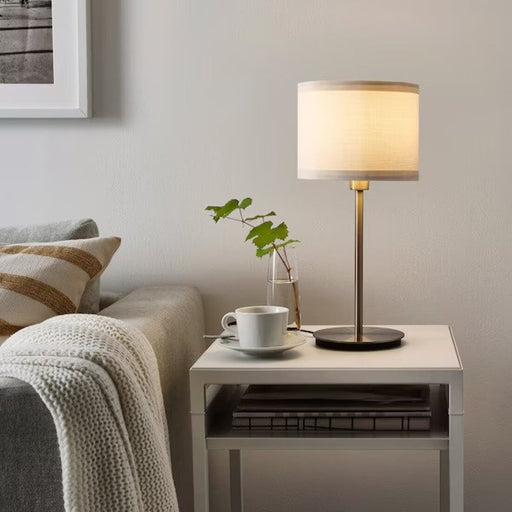 IKEA Table Lamp Base and Shade used in a living room, showcasing its ability to provide stylish and functional lighting 70405375 60405955 -70405376 00434668