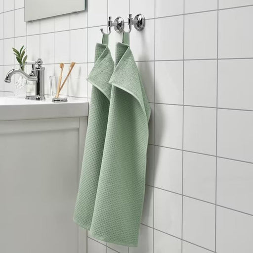An image of an IKEA hand towel in a light green  striped pattern, adding a classic and timeless touch to any bathroom 90512548 