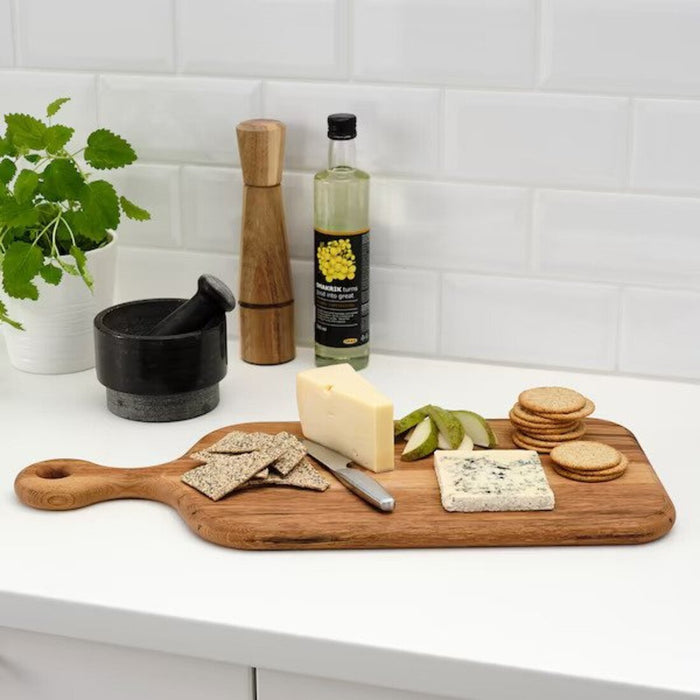 An IKEA cutting board set consisting of three boards in different sizes and colors, made of flexible and easy-to-clean material, perfect for organizing your kitchen.-60511084  