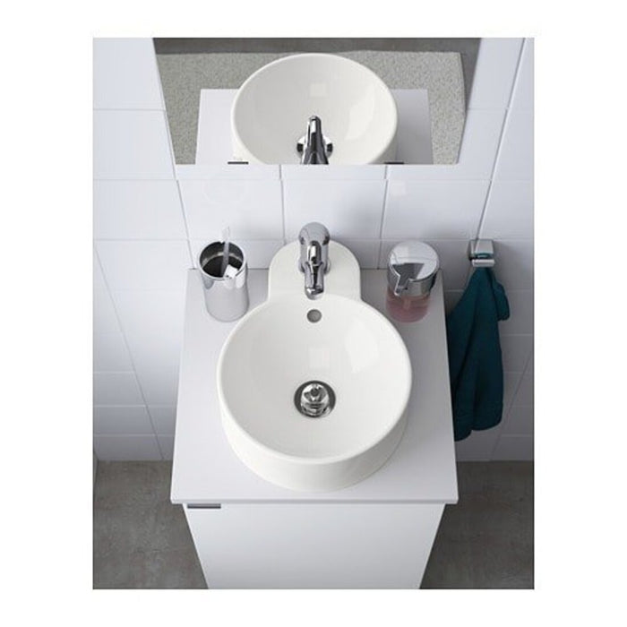 A close-up of an IKEA wash basin with a built-in soap dispenser and towel rack. 70354960