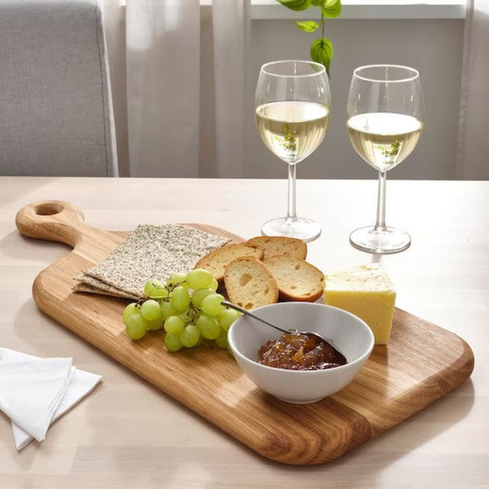 An IKEA wooden chopping board with a patterned surface and a convenient hole for hanging, adding a touch of style to your kitchen décor while being functional.-60511084  