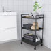 Digital Shoppy A black IKEA trolley placed in a kitchen setting, showing its practicality and versatility as a convenient surface for food preparation or an extra storage space. . 60407365 , black.