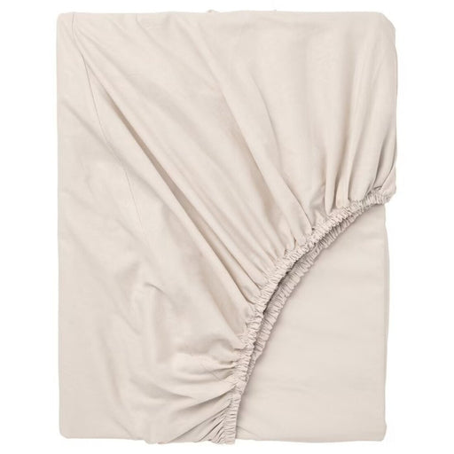 An IKEA fitted sheet in a soft, beige color 30357164   