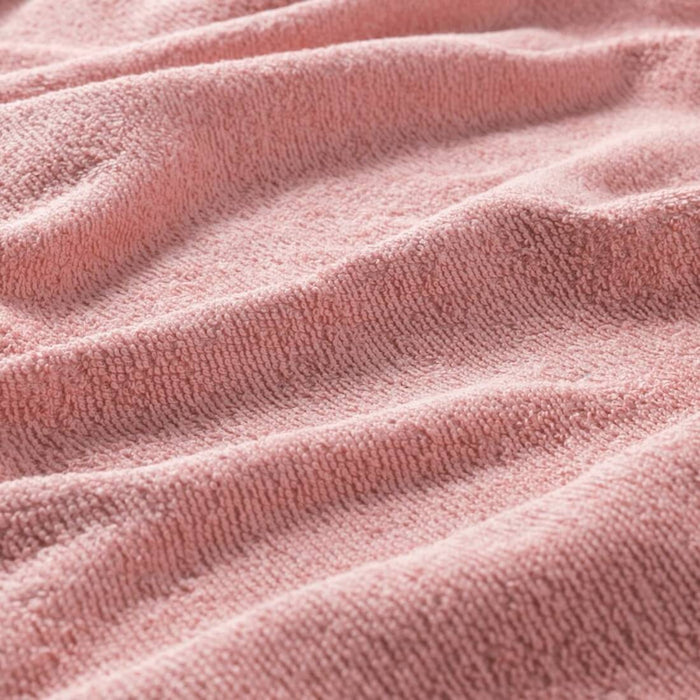 A close-up image of an IKEA hand towel in pink with a soft and absorbent surface 70456317 