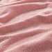 A close-up image of an IKEA hand towel in pink with a soft and absorbent surface 70456317 