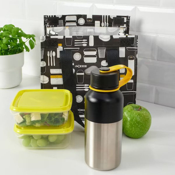 A family picnic setup with a large capacity vacuum flask, surrounded by sandwiches and fruits. 30521051