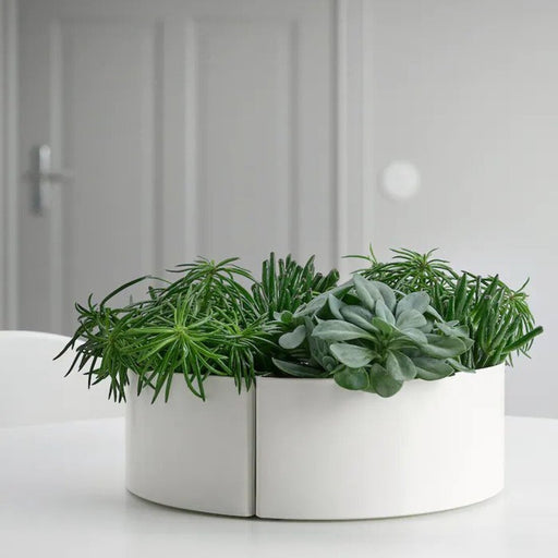 A modern IKEA plant pot with a minimalist design 30505447