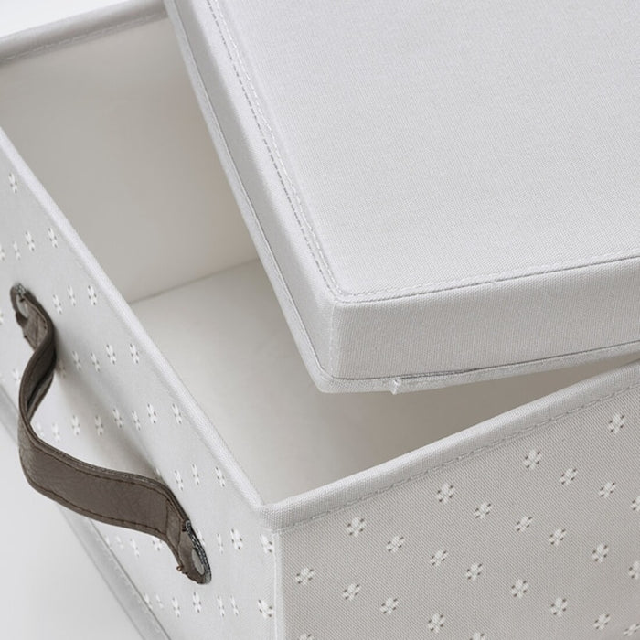 A sturdy cardboard IKEA storage box with a removable lid, ideal for organizing household items.