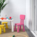 A pink IKEA Children's Chair with a lightweight, stackable design, made from durable plastic and featuring a smooth, curved seat and backrest for optimal comfort and suppor