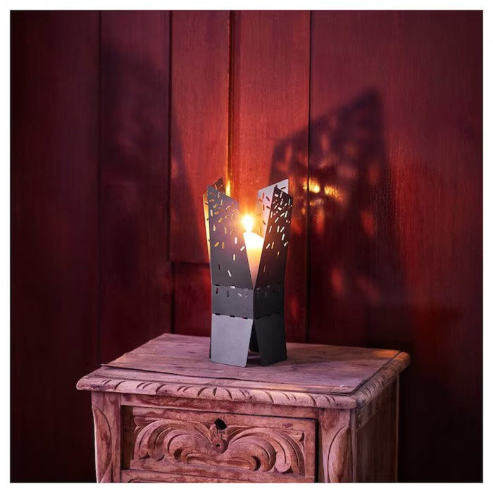 An elegant black candle holder from IKEA, standing 28 cm tall, with a simple yet stylish design. The holder is made of durable materials and can be used to create a warm and inviting ambiance in any room