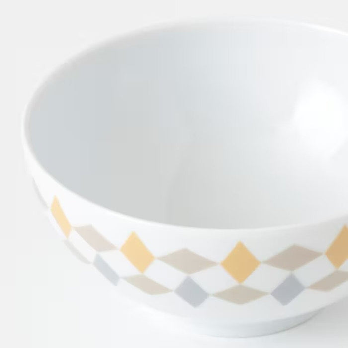 A white/beige Feldspar porcelain IKEA bowl with a smooth and glossy finish.
