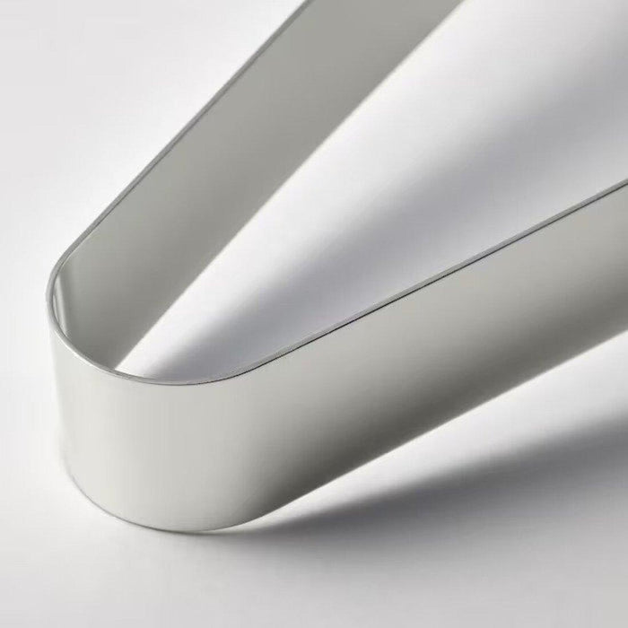 Digital Shoppy IKEA  close-up of a stainless steel serving tong's hinge mechanism and textured grip handles. 60546093