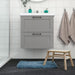 Soft and absorbent blue IKEA bath mat on a bathroom floor, providing comfort for the feet  40551759 
