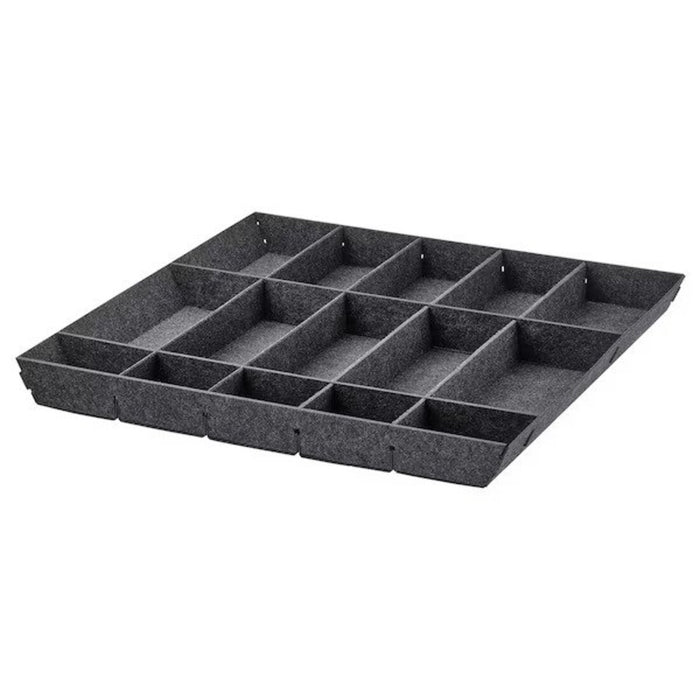 "Close-up of the IKEA Adjustable Organizer in Grey inside a drawer, with the movable dividers adjusted to create compartments of various sizes."