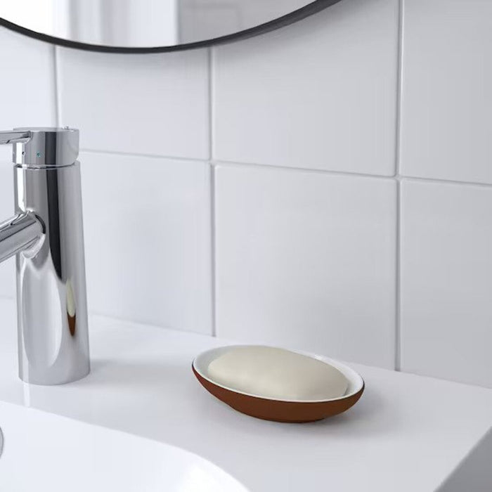 A sturdy soap holder in a neutral color, crafted from durable stoneware and ideal for everyday use. 30542299 