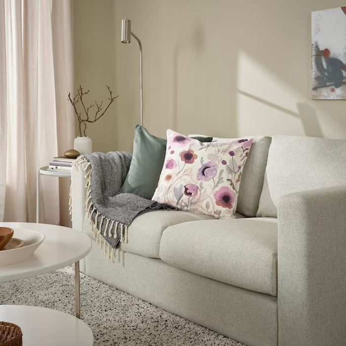 cushion cover from IKEA, measuring 50x50 cm, on a sofa with matching pillows - 00548194            