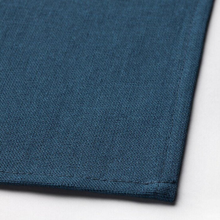 A close-up of a light turquoise and dark blue napkin 40545928            