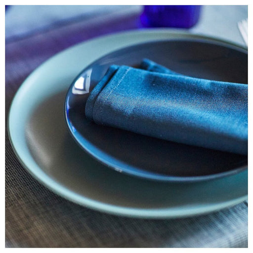 An elegant table setting with light turquoise and dark blue napkins from IKEA 40545928            
