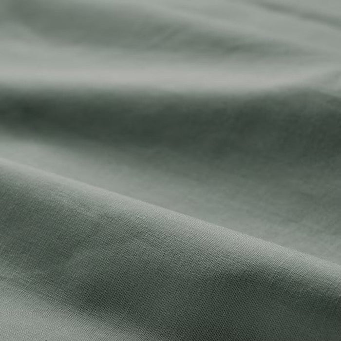 A close-up of the soft and durable grey-green pillowcase from IKEA  00549669 