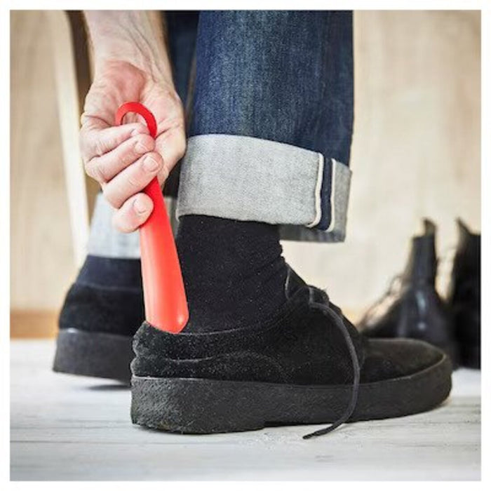 A versatile 18cm bright red shoehorn, perfect for helping to put on shoes with ease and comfort.