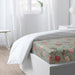 An IKEA fitted sheet with easy-care and wrinkle-resistant fabric, perfect for busy individuals  60556553