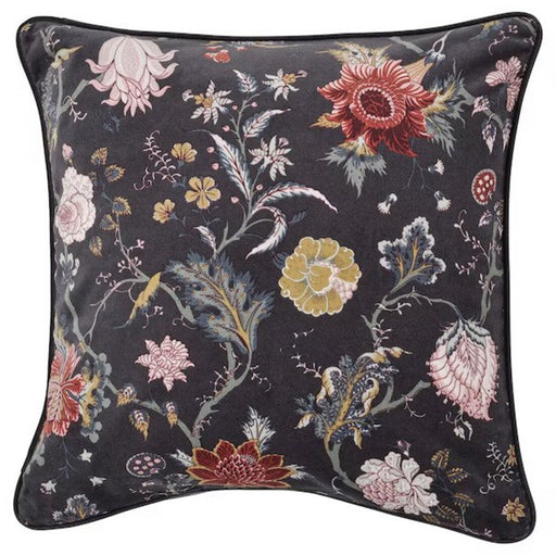 A close-up of a cushion cover with a modern floral pattern in shades