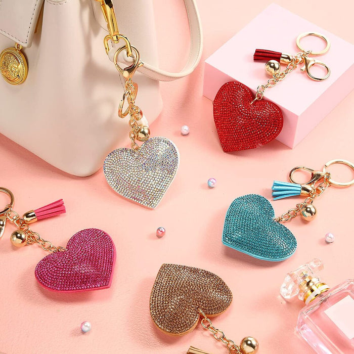 A crystal heart key chain in pink and blue tones