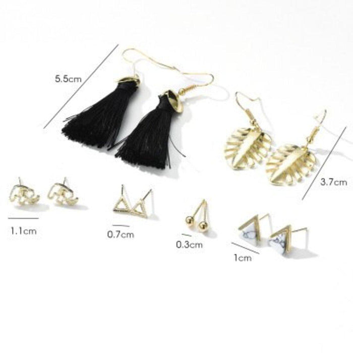 A set of mismatched earrings featuring one stud and one dangling earring with a unique, artistic design.