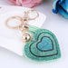 A women's key chain with a unique and eye-catching crystal heart design