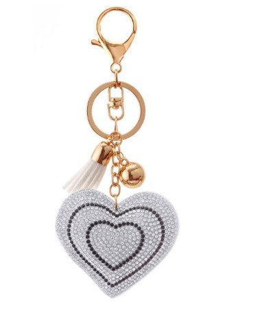 A close-up shot of a crystal heart key chain for women