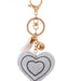 A close-up shot of a crystal heart key chain for women
