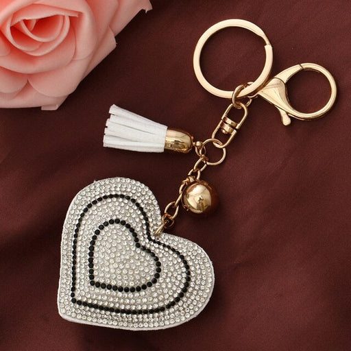 A beautiful crystal heart key chain with a silver-colored finish