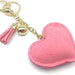 A heart-shaped key chain with a large, multi-faceted crystal charm