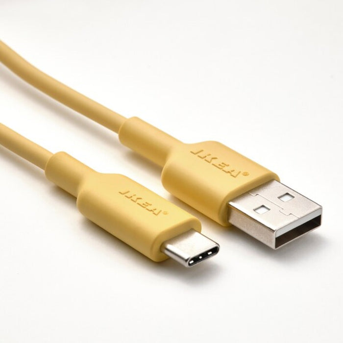 A light yellow USB-A to USB-C cable with both ends plugged into a USB-C dock station-90539487