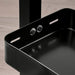a closeup image of an IKEA desktop shelf with a smooth, Black finish and curved edges 60541571