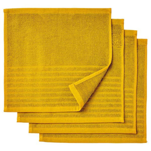 IKEA close-up of an IKEA washcloth in golden-yellow. The cloth is folded and placed on a white surface, and its soft texture is visible.