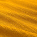 Digital Shoppy IKEA An image of an IKEA washcloth in golden-yellow. The cloth is draped over a towel rack, and its soft texture and absorbent properties are visible.