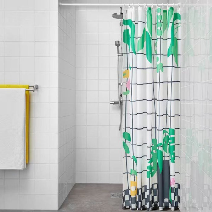 An image of a person taking a shower behind the white/green shower curtain from IKEA, which provides privacy and style to the bathroom. The durable material ensures the curtain stays in place during use-Digital Shoppy
