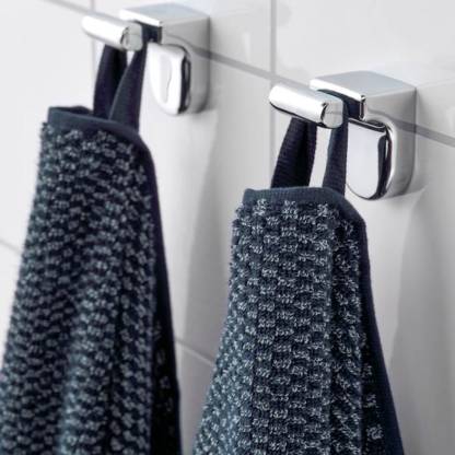 A close-up image of a simple and classic dark blue hand towel hanging on a bathroom 30490177